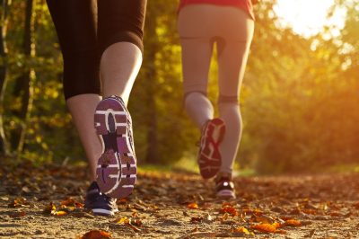 Fitness,Girl,Running,At,Sunset,In,Forest